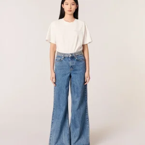 Jeans flare con cintura de clavos
