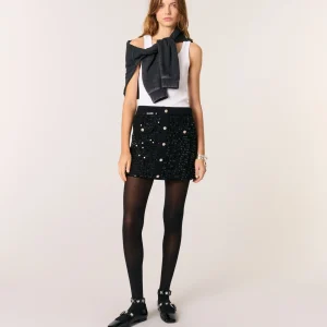 Falda corta de punto y lentejuelas