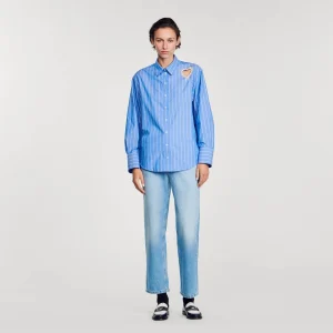 Camisa a rayas y corazón de brillantes