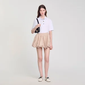 Polo con botones de fantasía